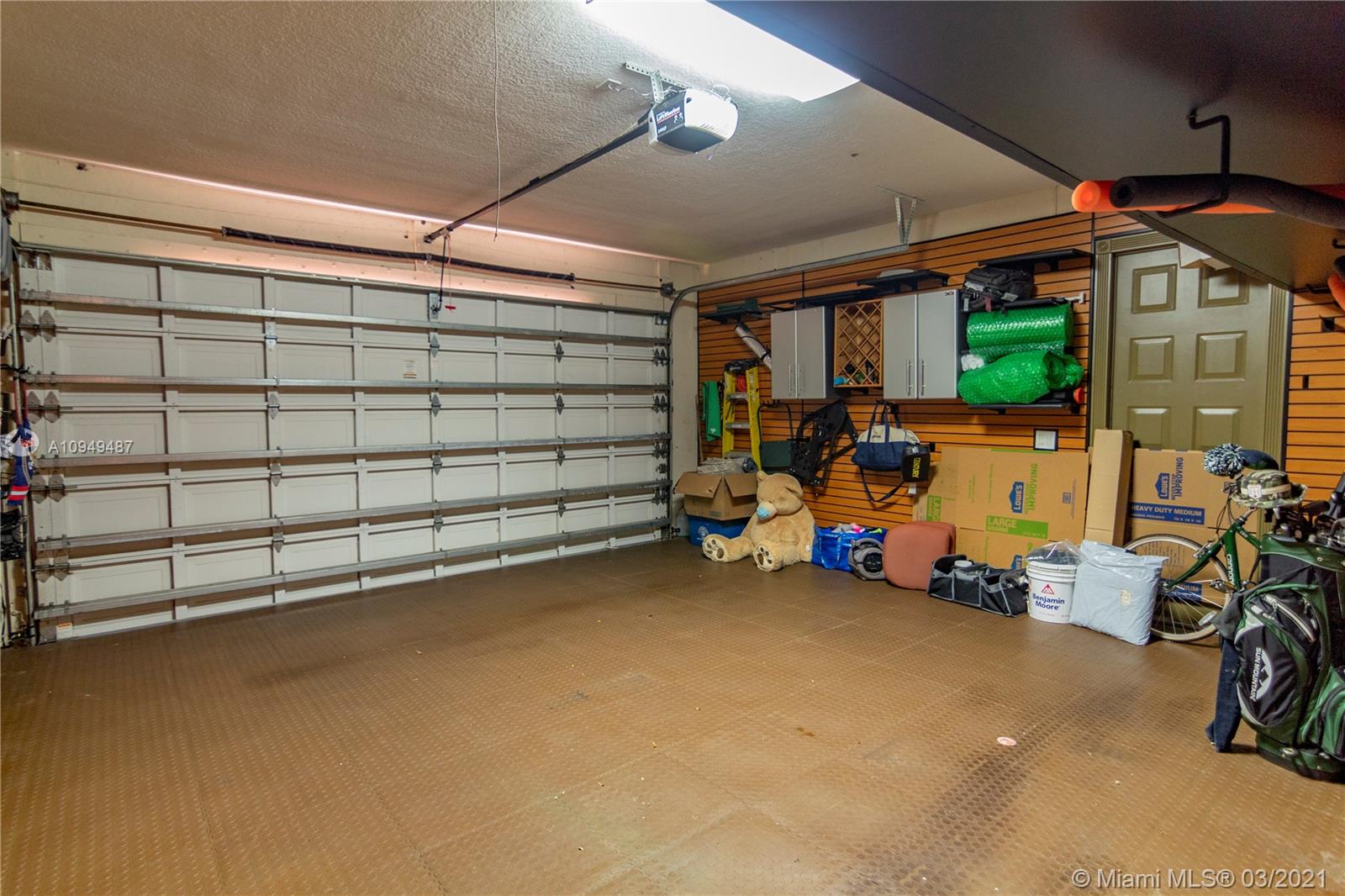 2273 Southwest 132nd Way Davie, FL 33325 - Photo 41 of 48 a view of a garage with rack and bicycle