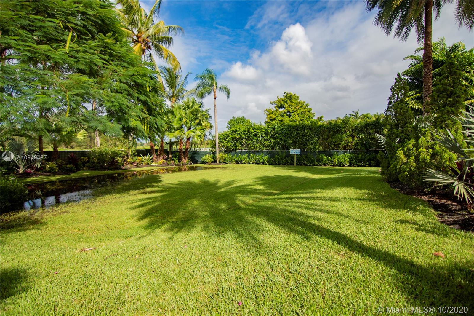2273 Southwest 132nd Way Davie, FL 33325 - Photo 42 of 48 a swimming pool with outdoor seating and yard