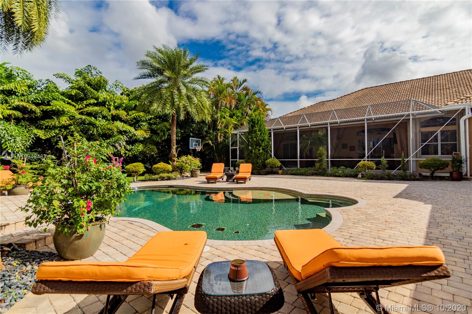 2273 Southwest 132nd Way Davie, FL 33325 - Photo 43 of 48 a view of a table and chairs in patio with a garden