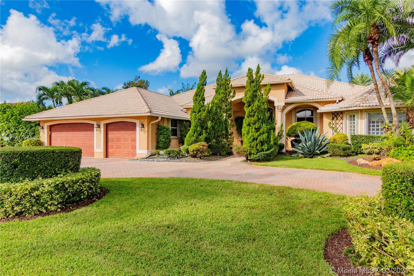 2273 Southwest 132nd Way Davie, FL 33325 - Photo 44 of 48 a front view of a house with a garden