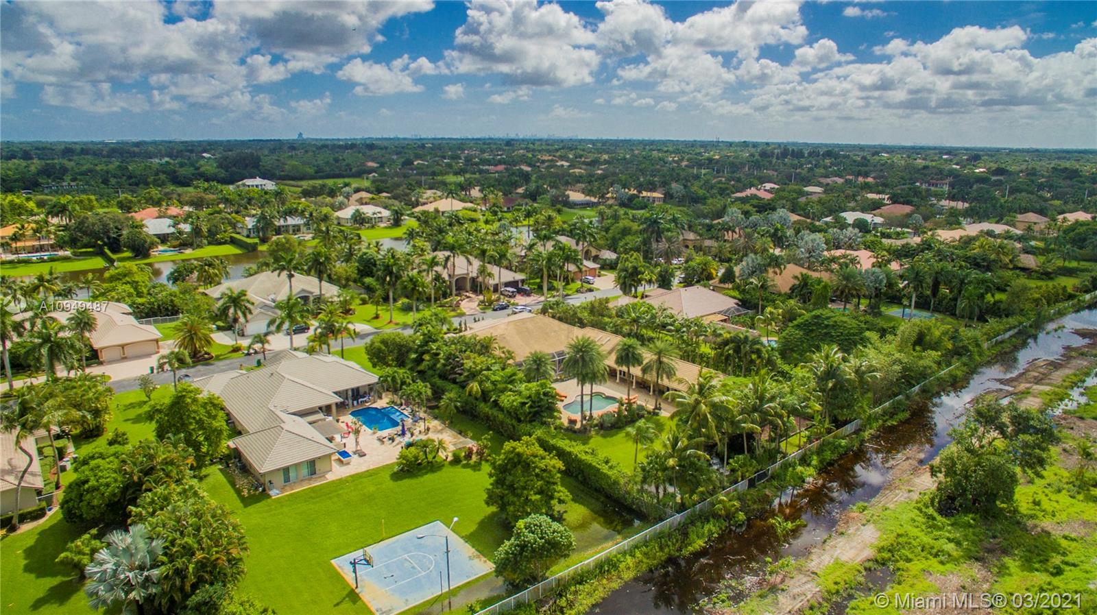 2273 Southwest 132nd Way Davie, FL 33325 - Photo 47 of 48 an aerial view of residential houses with outdoor space and trees