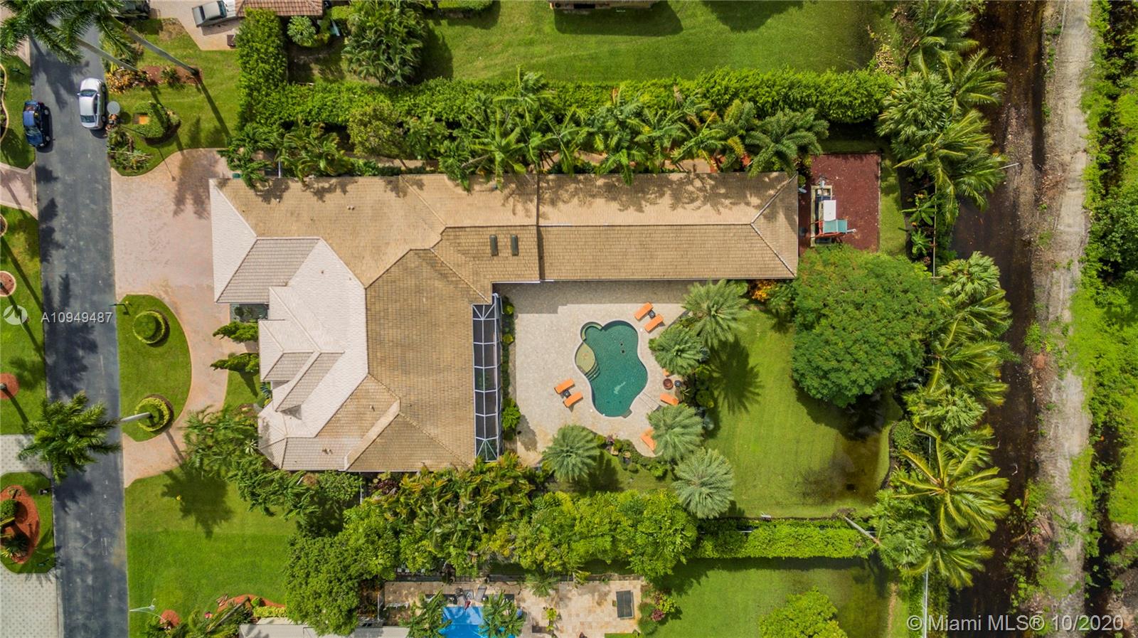 2273 Southwest 132nd Way Davie, FL 33325 - Photo 48 of 48 an aerial view of a house with a yard and large trees