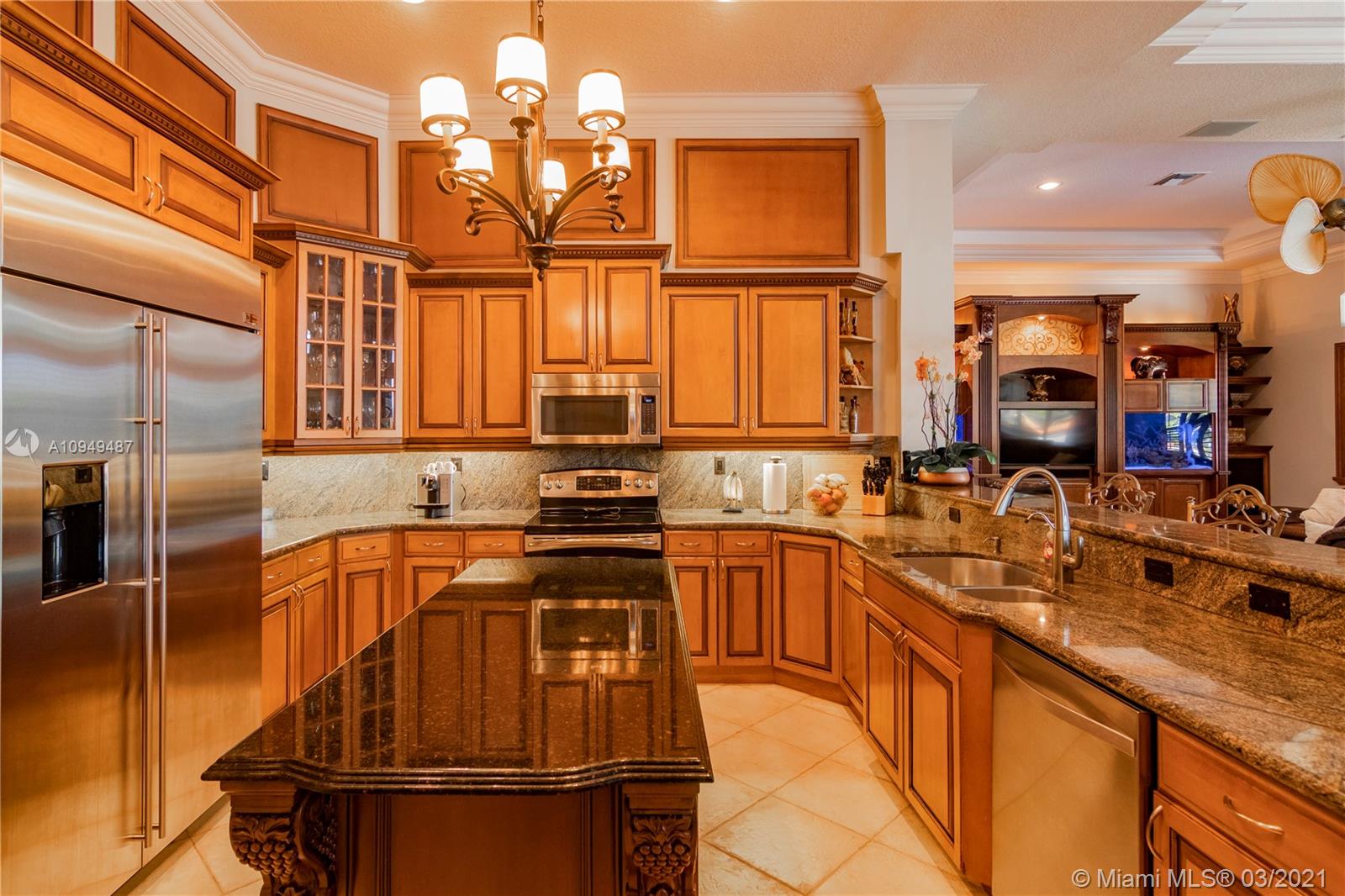 2273 Southwest 132nd Way Davie, FL 33325 - Photo 10 of 48 a kitchen with stainless steel appliances granite countertop a sink stove and refrigerator