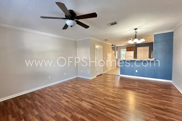 a view of a kitchen with a sink and a window