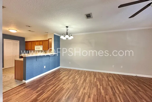 a view of a kitchen with a dishwasher and cabinets