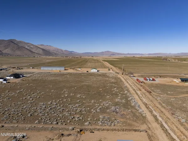 a view of an ocean beach and mountain