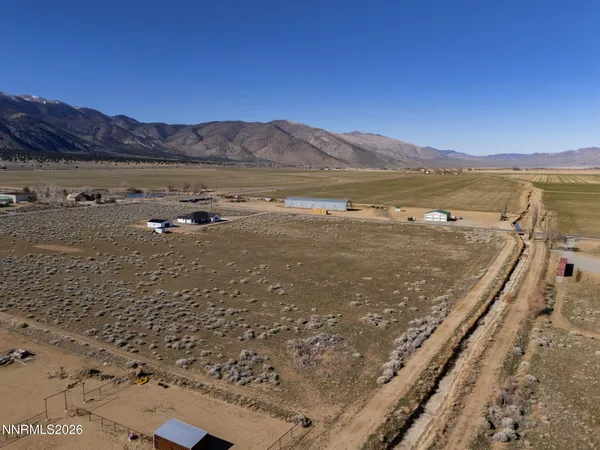 a view of a dry yard with mountain