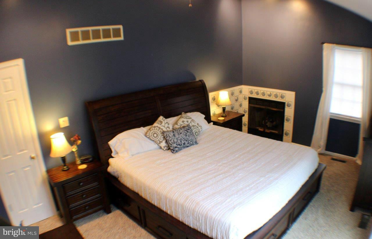 2701 Greene Road Baldwin, MD 21013 - Photo 12 of 29 a bed sitting in a bedroom and a balcony