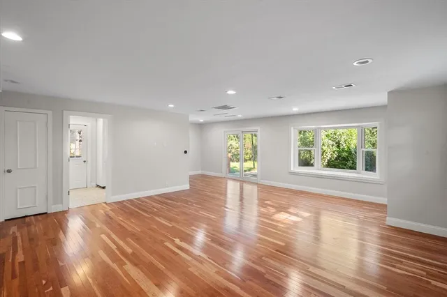 a view of a kitchen with flat screen tv and refrigerator