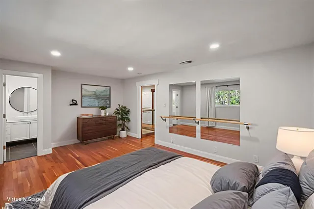 a bedroom with a bed and a desk