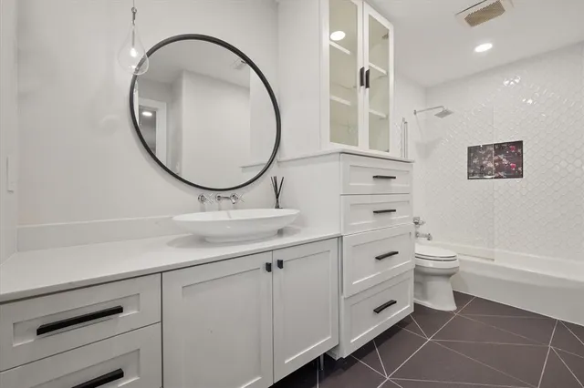 a bedroom with furniture a bed and a couch