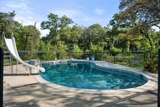 a bathroom with a toilet a sink and a mirror