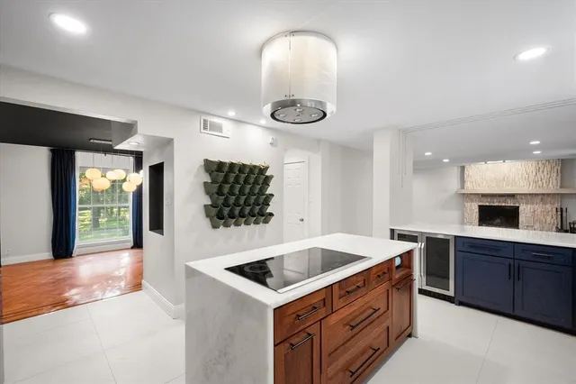 a kitchen that has a sink and a stove in it