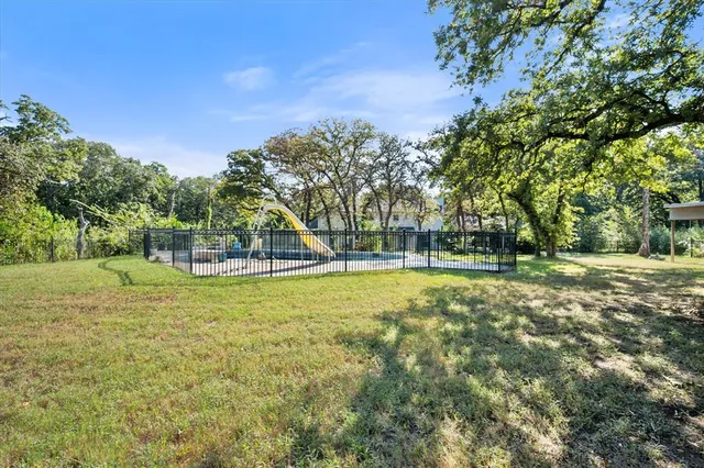 a view of a playground with basketball court