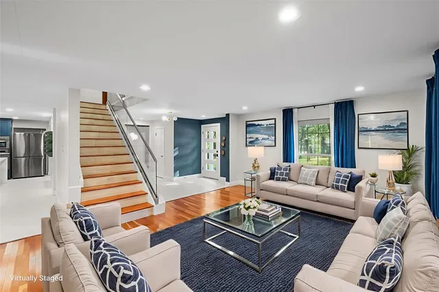 a living room with furniture and a table