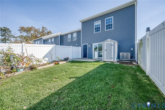 a view of house with backyard and garden