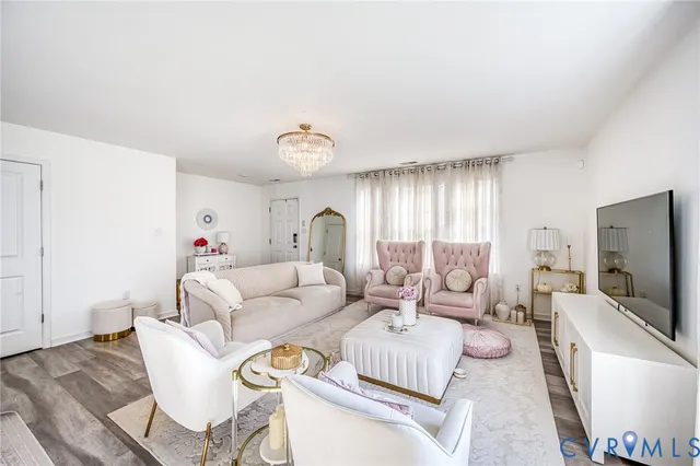 a living room with furniture and a flat screen tv