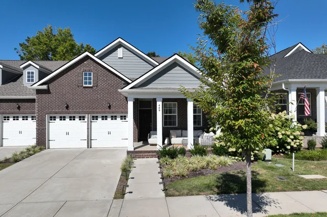 a front view of a house with garden