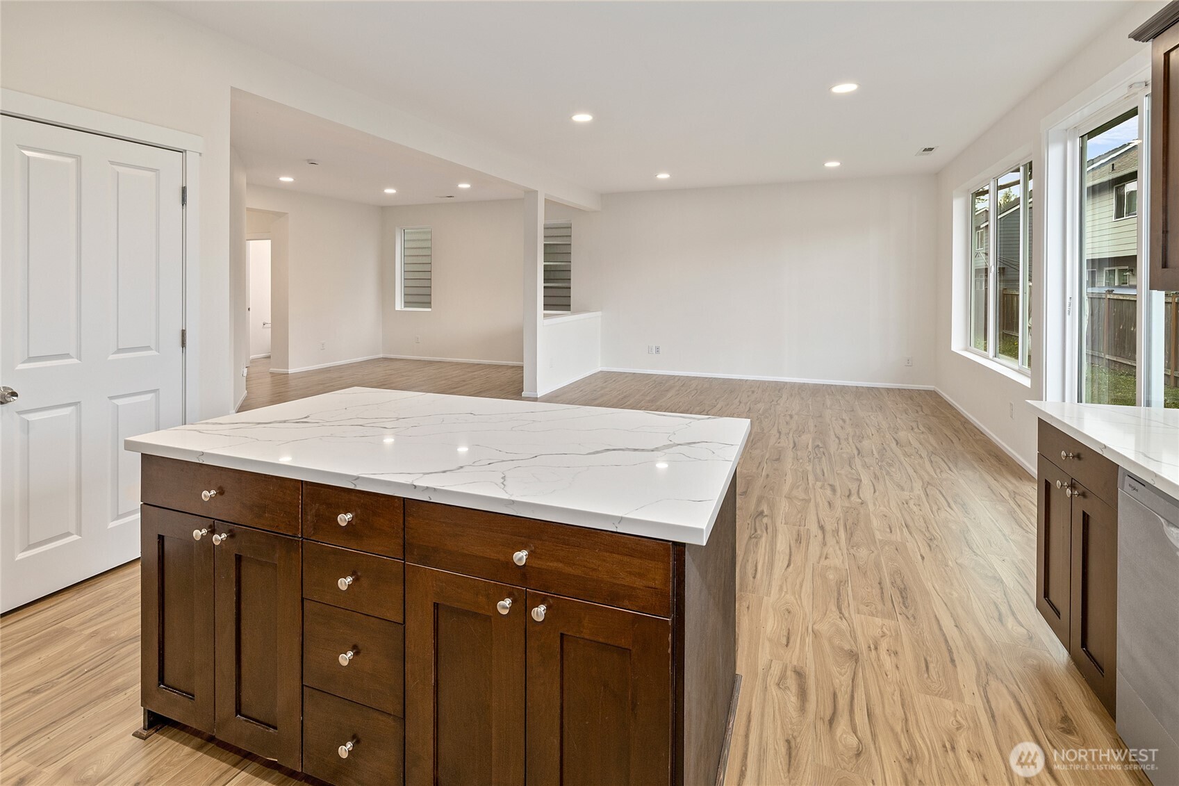 8117 175th St Court East Puyallup, WA 98375 - Photo 12 of 40 a kitchen with a sink a counter space and wooden floor