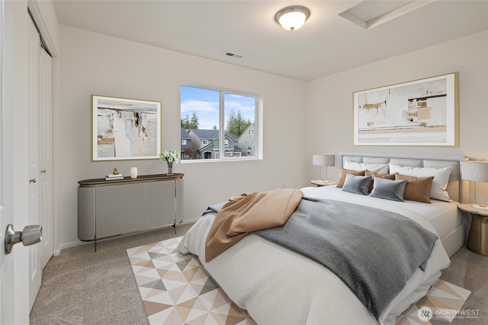 8117 175th St Court East Puyallup, WA 98375 - Photo 17 of 40 a bedroom with a bed and a painting on the wall