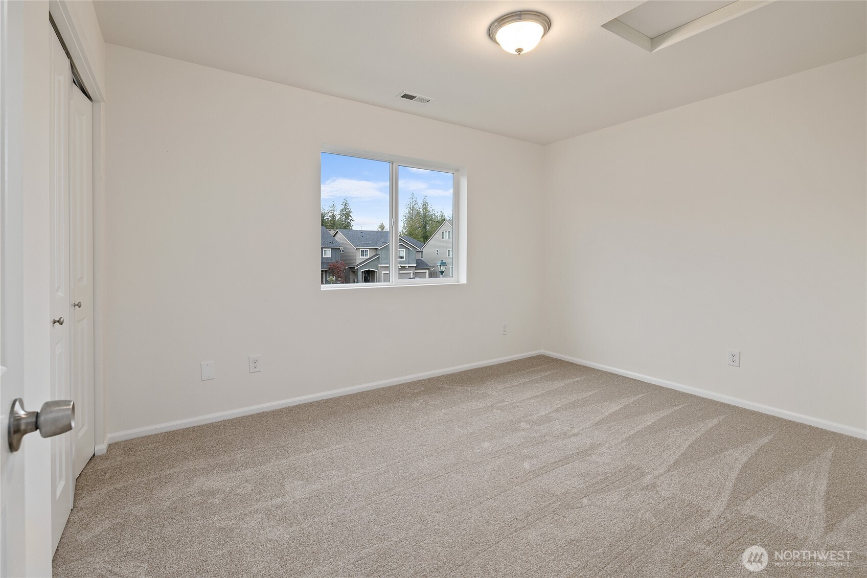 8117 175th St Court East Puyallup, WA 98375 - Photo 18 of 40 an empty room with a window