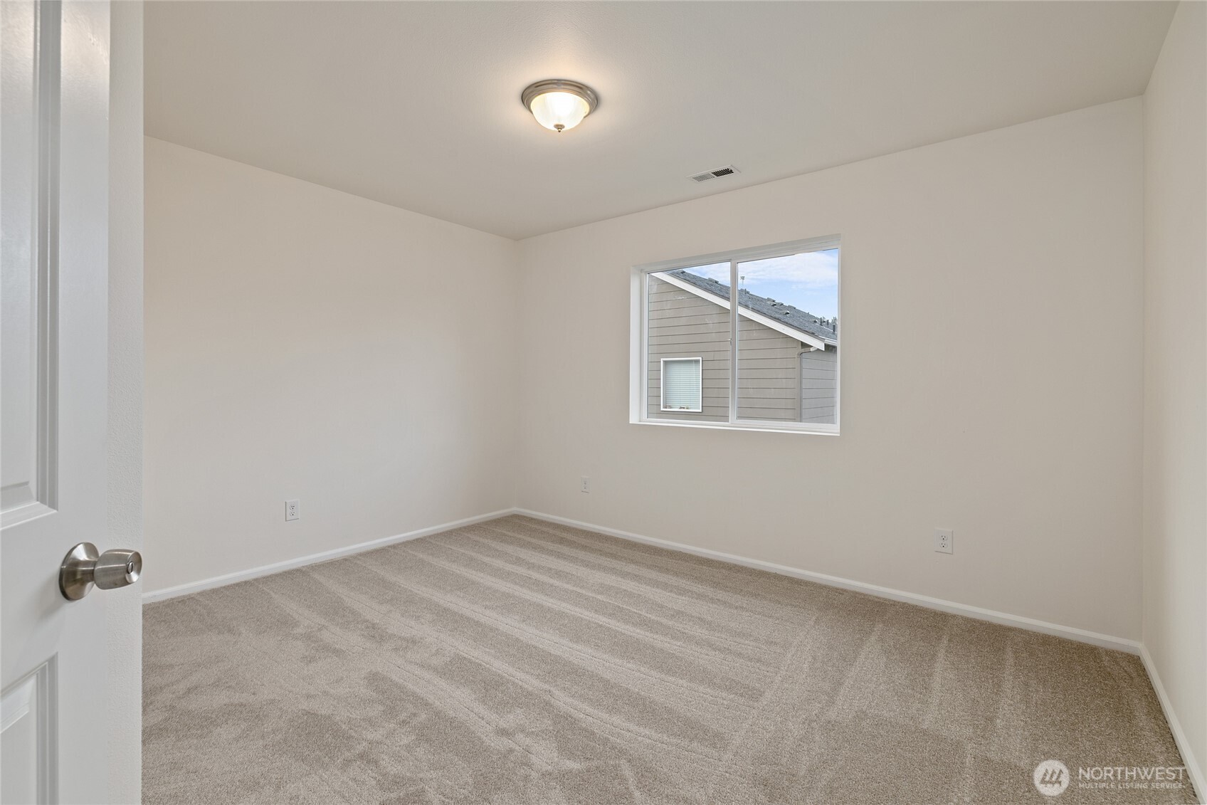 8117 175th St Court East Puyallup, WA 98375 - Photo 20 of 40 an empty room with a window