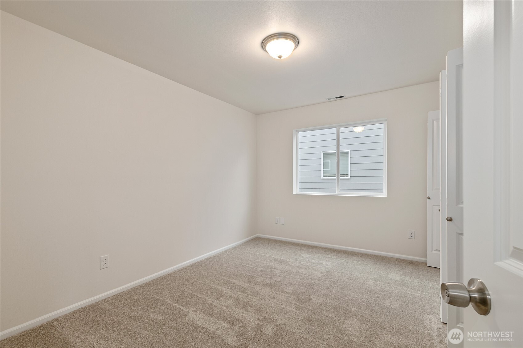 8117 175th St Court East Puyallup, WA 98375 - Photo 24 of 40 an empty room with windows