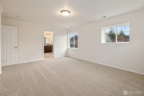 a bathroom with a shower and a glass door