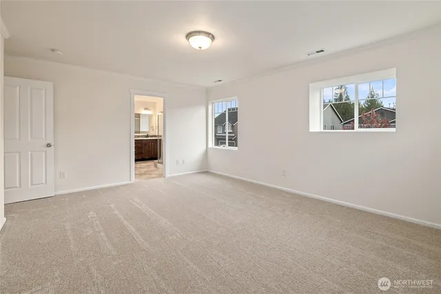 a bathroom with a shower and a glass door