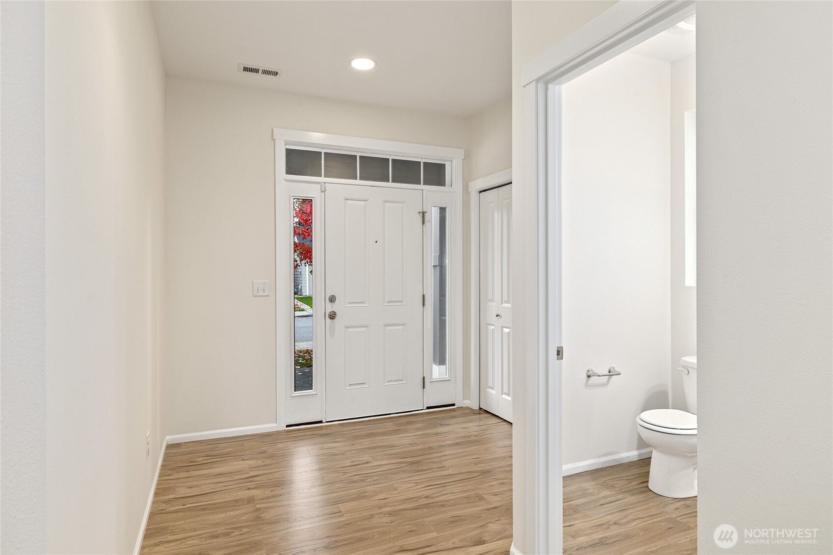 8117 175th St Court East Puyallup, WA 98375 - Photo 3 of 40 a bathroom with a toilet and a shower