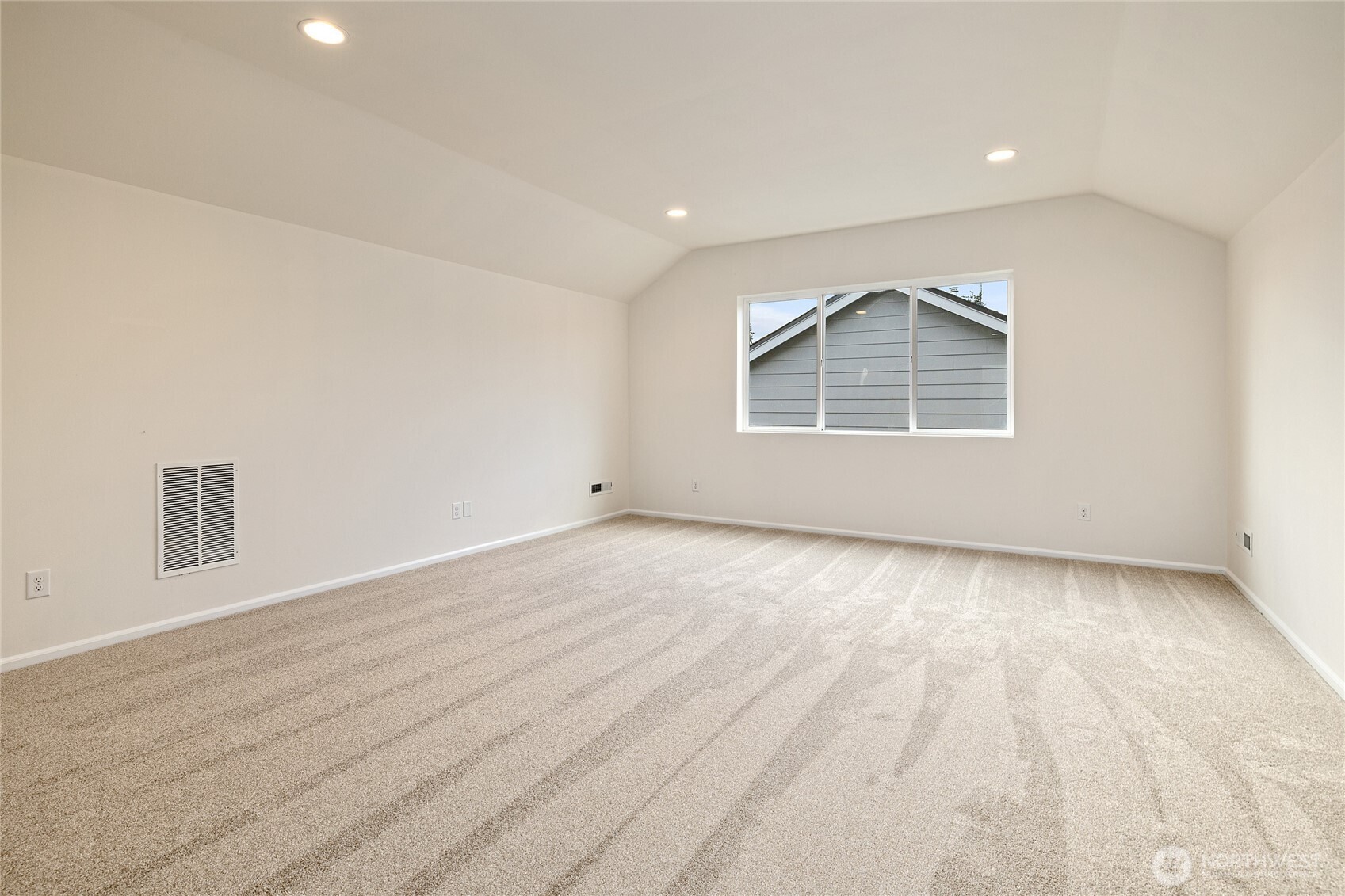 8117 175th St Court East Puyallup, WA 98375 - Photo 35 of 40 an empty room with wooden floor and windows