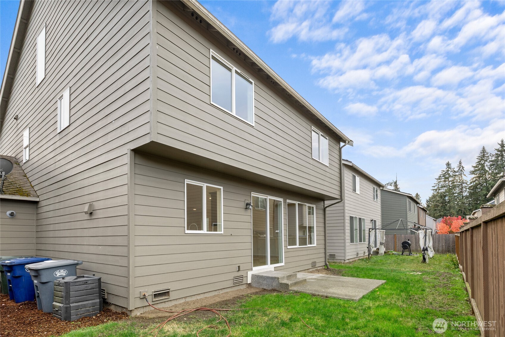8117 175th St Court East Puyallup, WA 98375 - Photo 37 of 40 a front view of house with a garden