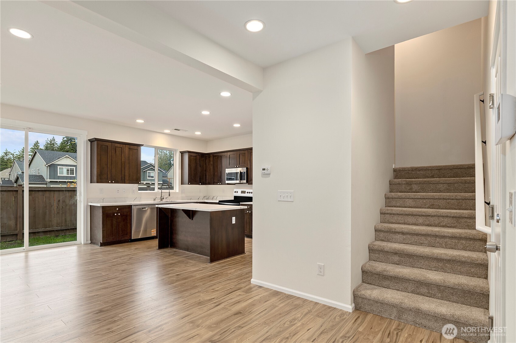 8117 175th St Court East Puyallup, WA 98375 - Photo 8 of 40 a view of kitchen with sink and refrigerator