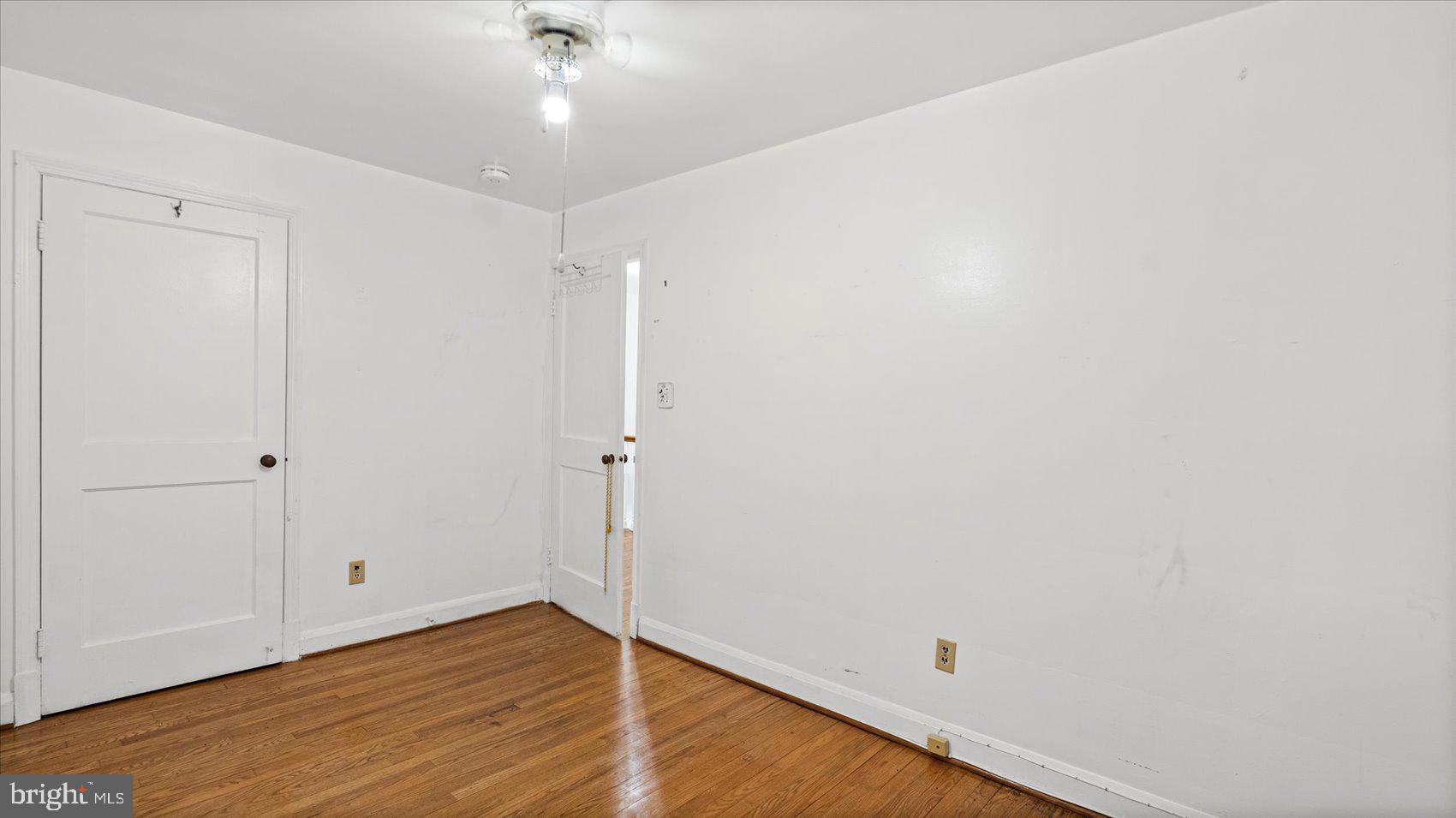1805 Crestview Road Baltimore, MD 21239 - Photo 26 of 39 a view of an empty room with wooden floor