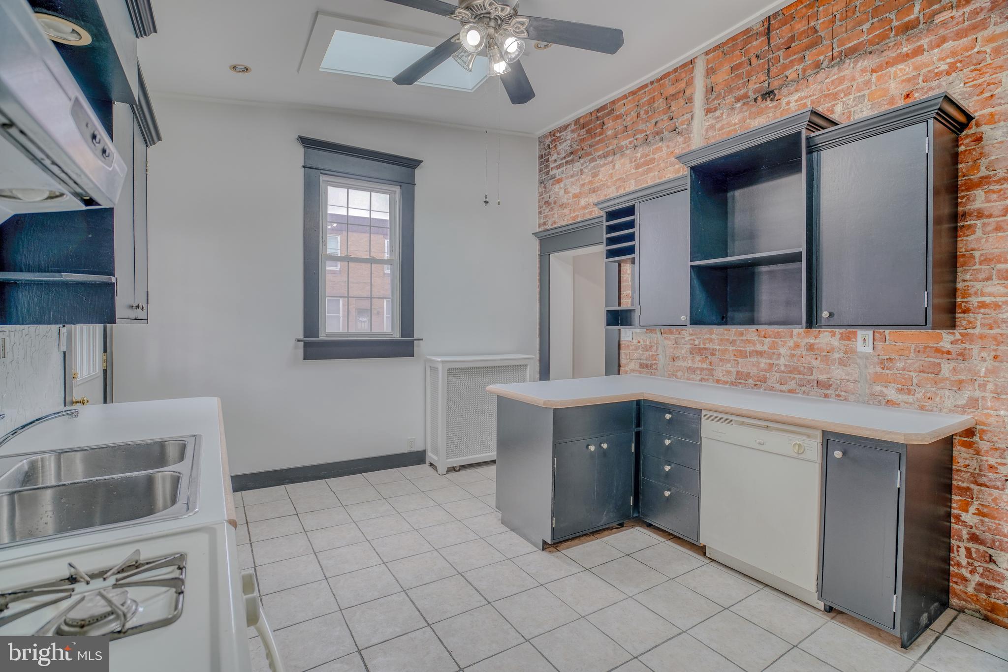 4501 Edgemont Street Philadelphia, PA 19137 - Photo 14 of 40 a kitchen with stainless steel appliances granite countertop a sink and a stove