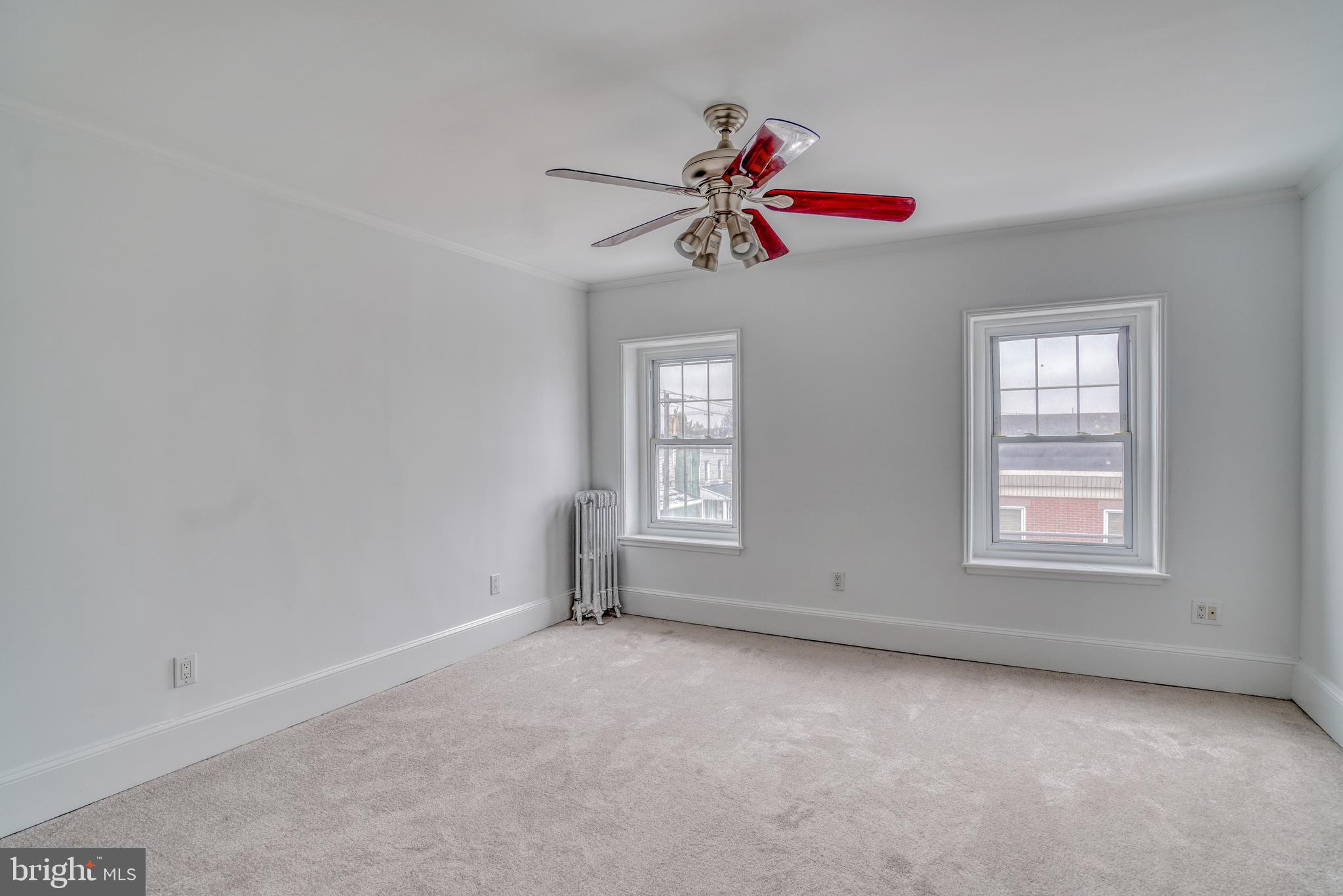 4501 Edgemont Street Philadelphia, PA 19137 - Photo 18 of 40 an empty room with windows and fan