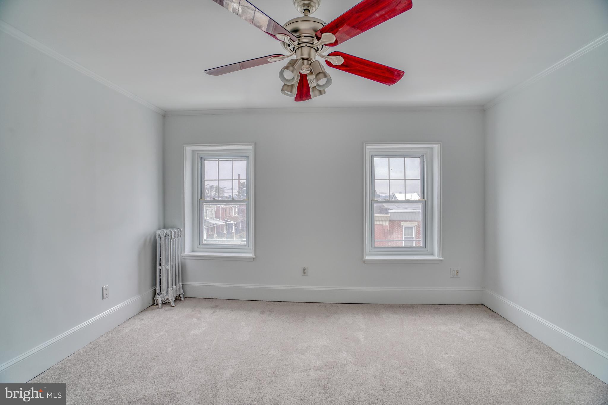 4501 Edgemont Street Philadelphia, PA 19137 - Photo 20 of 40 an empty room with windows and fan