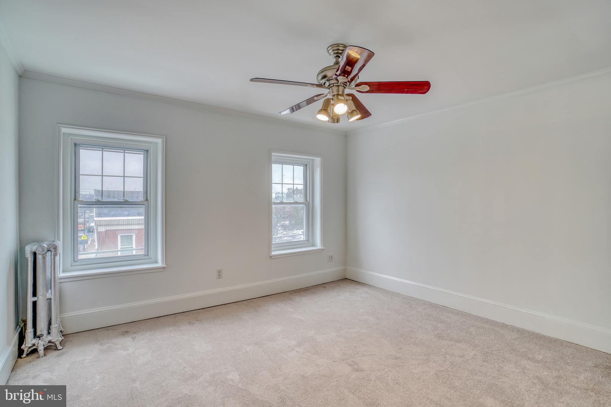 4501 Edgemont Street Philadelphia, PA 19137 - Photo 22 of 40 an empty room with windows and fan