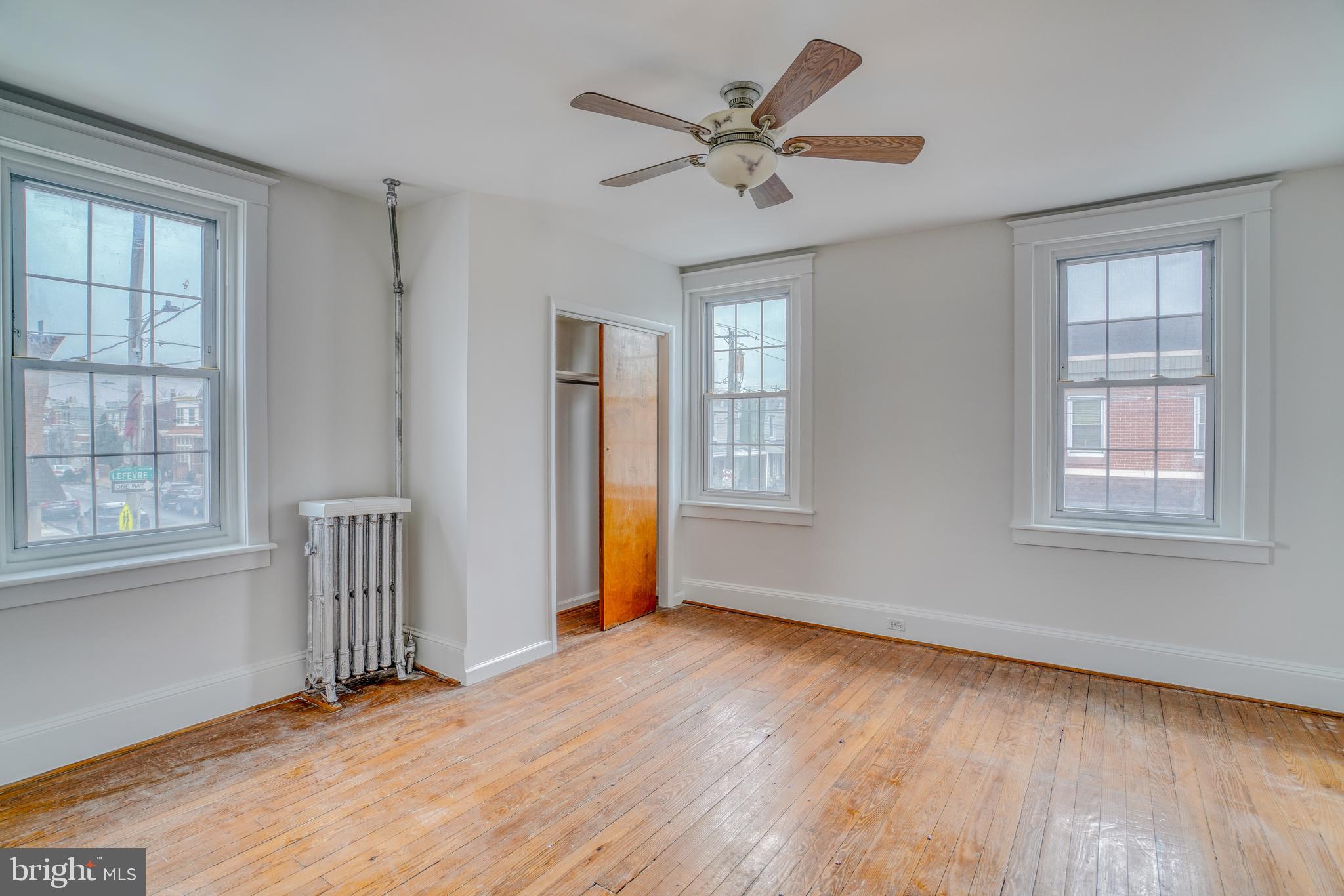 4501 Edgemont Street Philadelphia, PA 19137 - Photo 23 of 40 a view of an empty room with a window and wooden floor