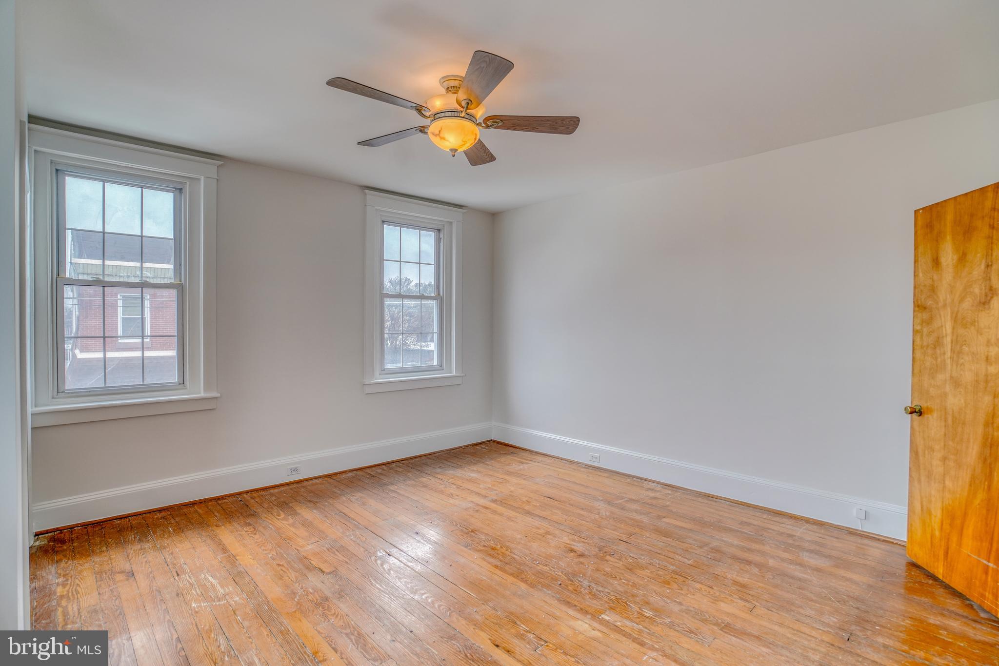 4501 Edgemont Street Philadelphia, PA 19137 - Photo 29 of 40 a view of an empty room with wooden floor and a window