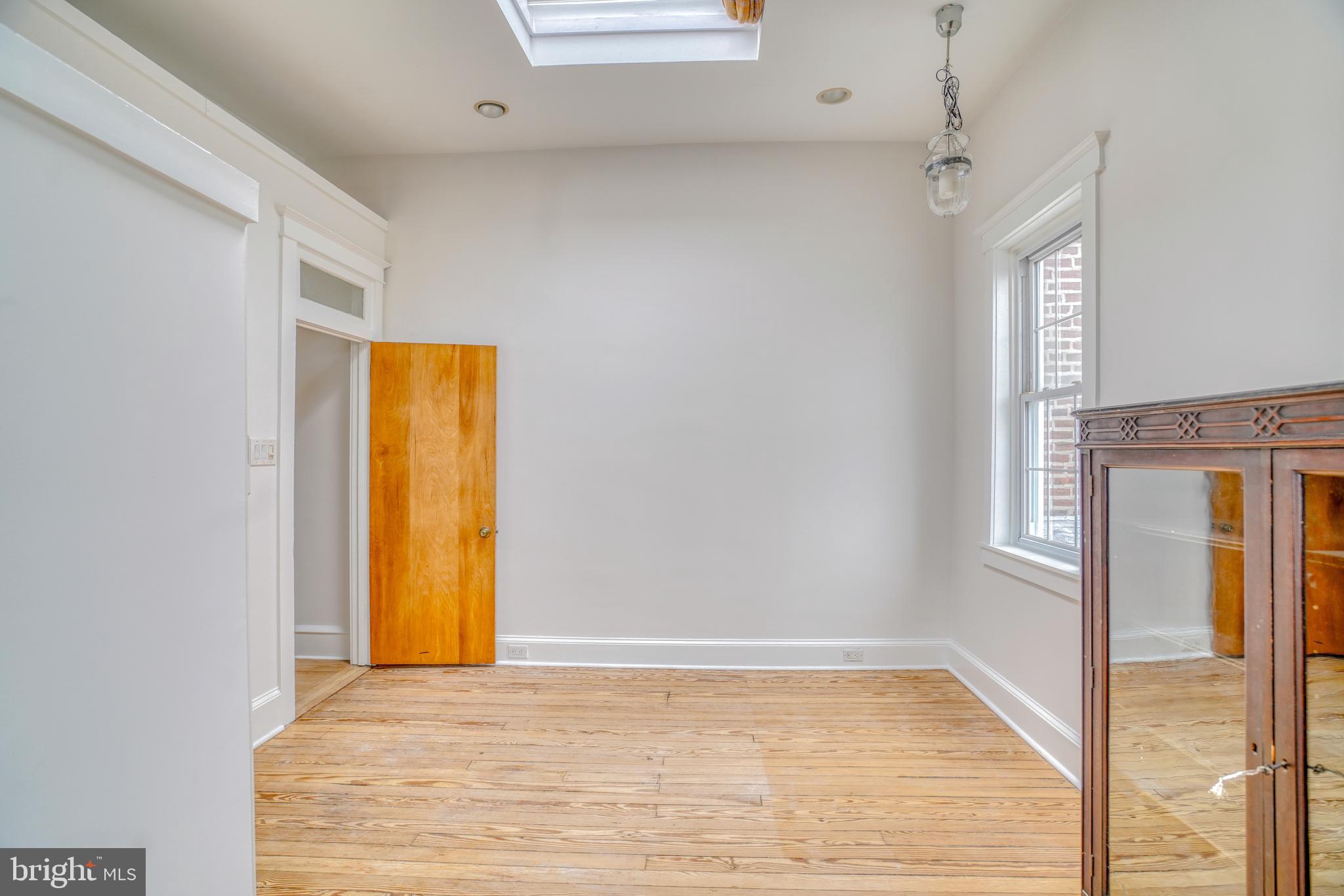 4501 Edgemont Street Philadelphia, PA 19137 - Photo 36 of 40 a view of an empty room with window and wooden floor