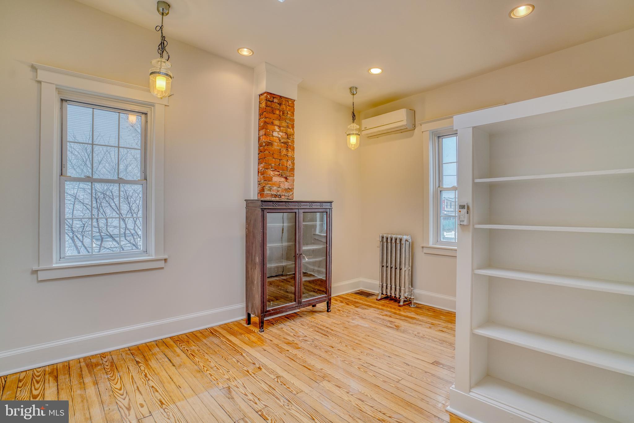 4501 Edgemont Street Philadelphia, PA 19137 - Photo 37 of 40 a view of an empty room with a window and wooden floor