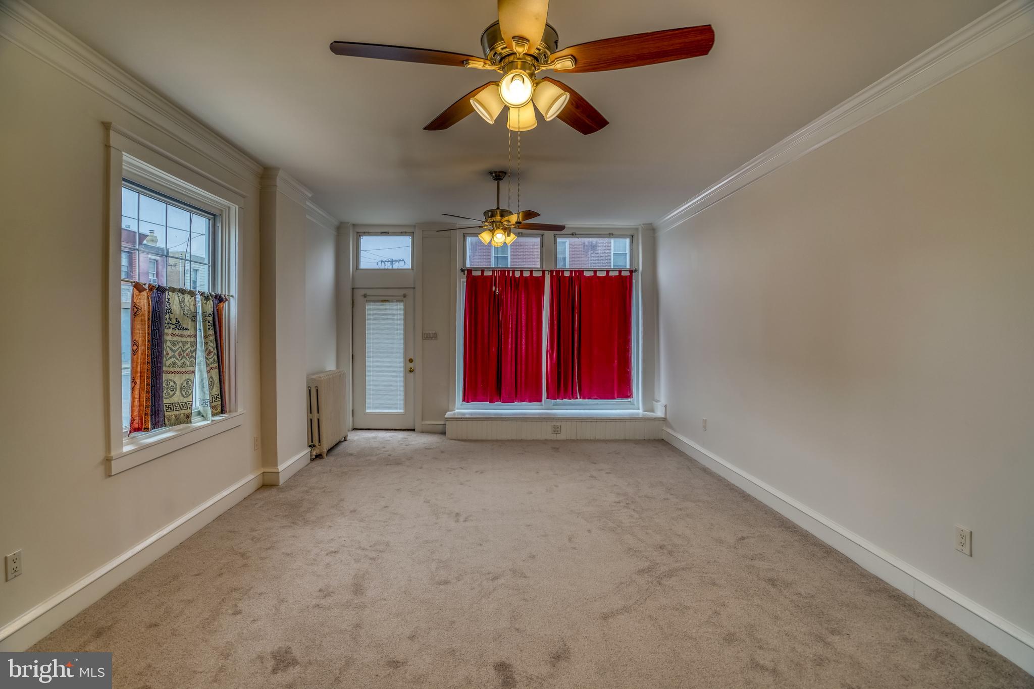 4501 Edgemont Street Philadelphia, PA 19137 - Photo 6 of 40 a view of empty room with chandelier fan and window
