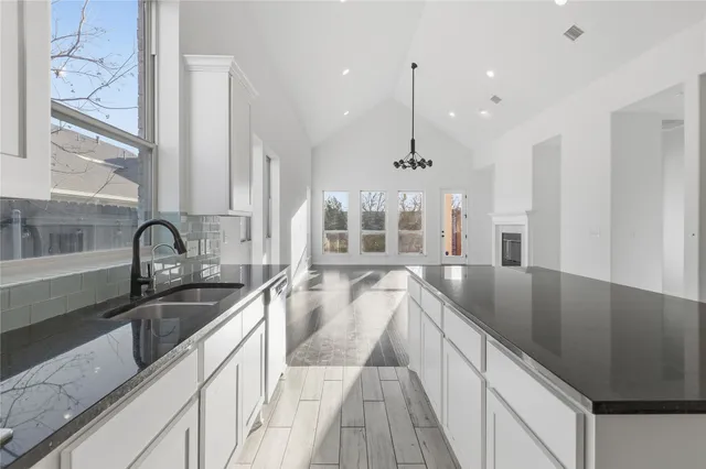 a view of a kitchen with a large window