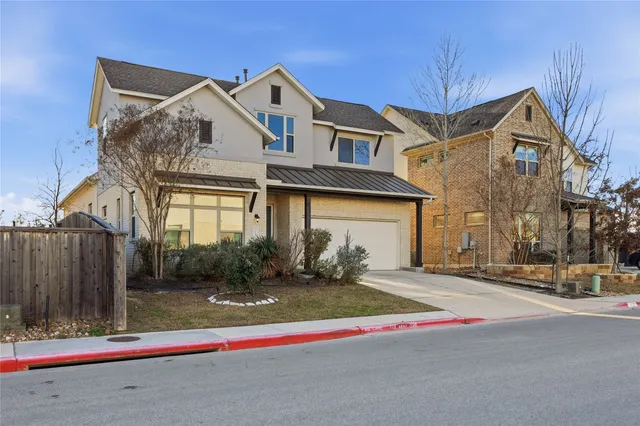 a front view of a house with garage