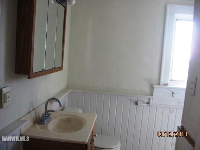 16747 West White Oak Road Forreston, IL 61030 - Photo 12 of 24 a bathroom with a sink and a mirror