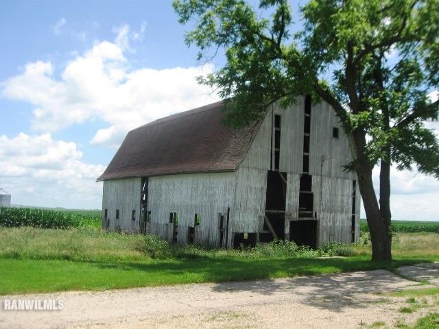 16747 West White Oak Road Forreston, IL 61030 - Photo 18 of 24 a front view of a house with garden