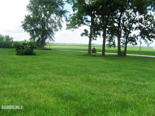 16747 West White Oak Road Forreston, IL 61030 - Photo 21 of 24 a view of grassy field with benches