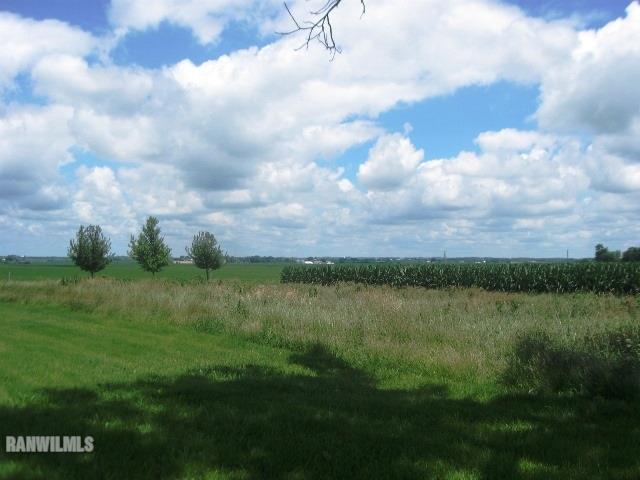 16747 West White Oak Road Forreston, IL 61030 - Photo 22 of 24 a view of a lake with houses in the back