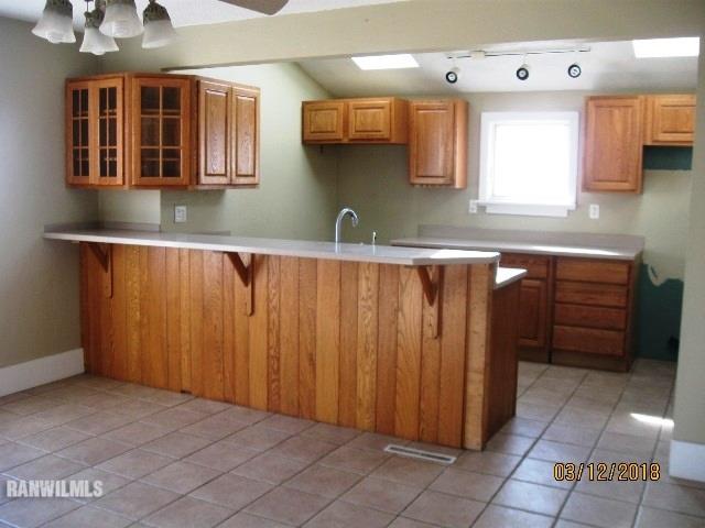 16747 West White Oak Road Forreston, IL 61030 - Photo 4 of 24 a kitchen with stainless steel appliances a sink and cabinets